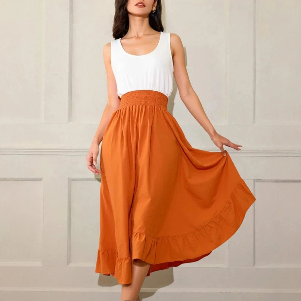 robe d’été midi blanche et orange style fluide sans manches, parfaite pour une journée plage chic