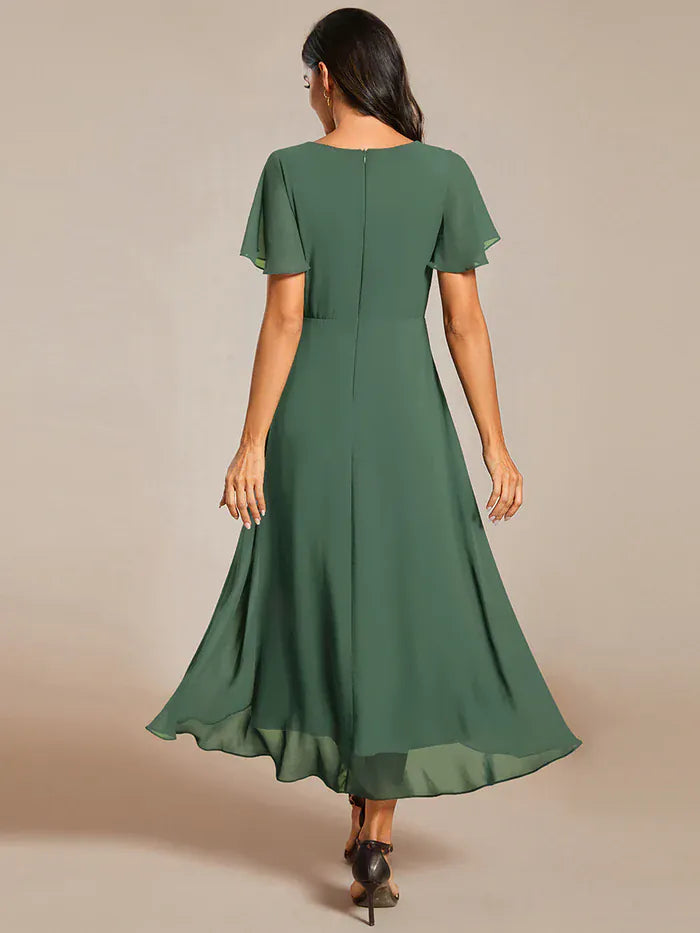 Robe de cocktail asymétrique verte