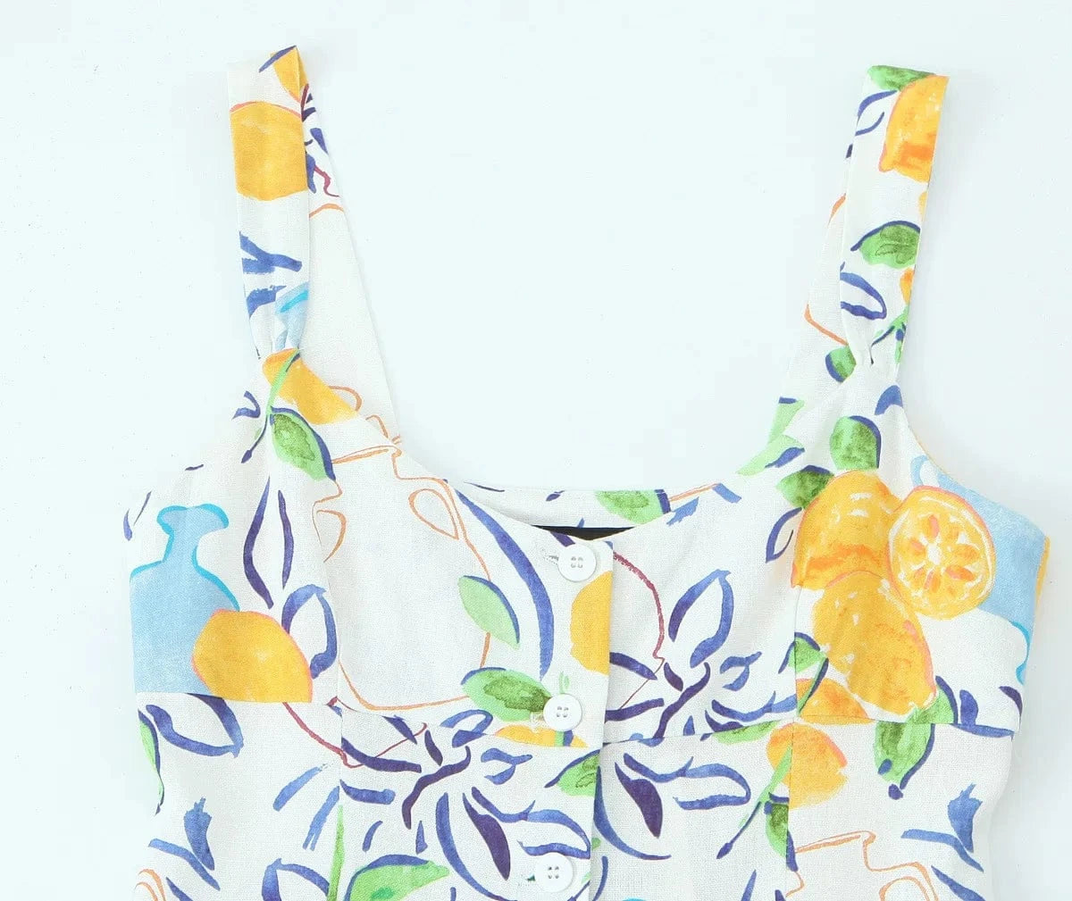 robe été bohème fluide multicolore boutonnée midi sans manches pour sortie plage ou vacances chic