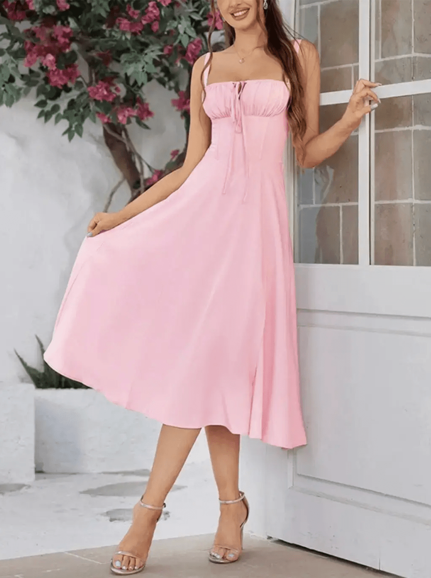 Robe été midi sans manches rose poudré fluide chic idéale pour journée ensoleillée.