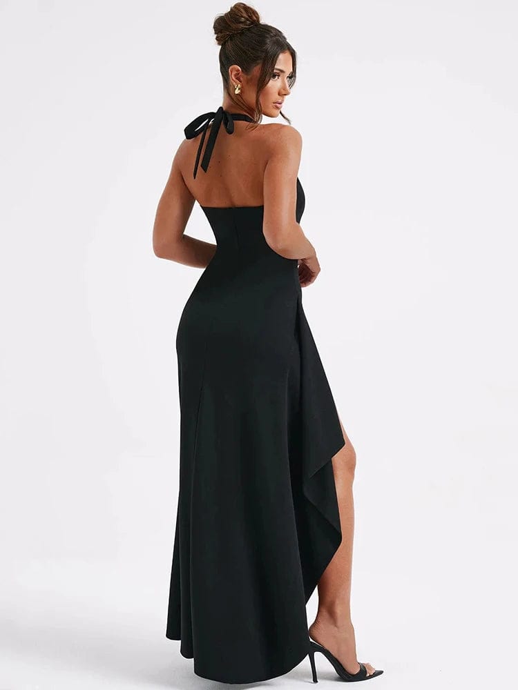 Robe longue noire élégante avec décolleté dos nu et fente, idéale pour soirée chic ou événement cocktail.