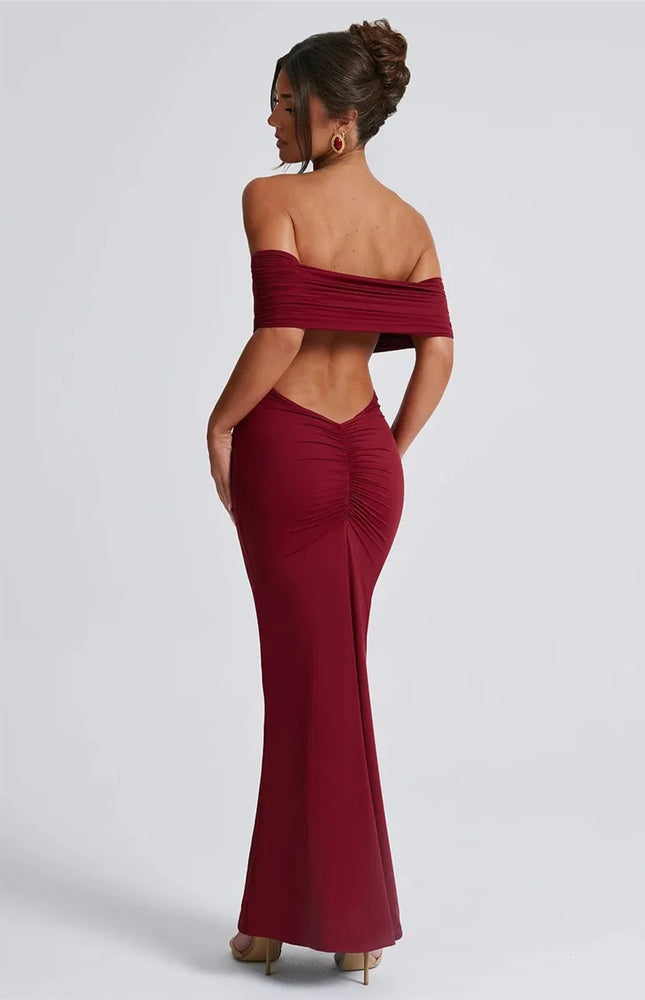 Robe soirée dos nu bordeaux longue moulante sans manches pour gala ou mariage invité chic.