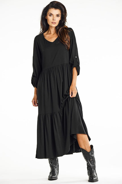 Robe noire midi soirée manche longue fluide femme, idéale pour cocktail ou événement élégant.