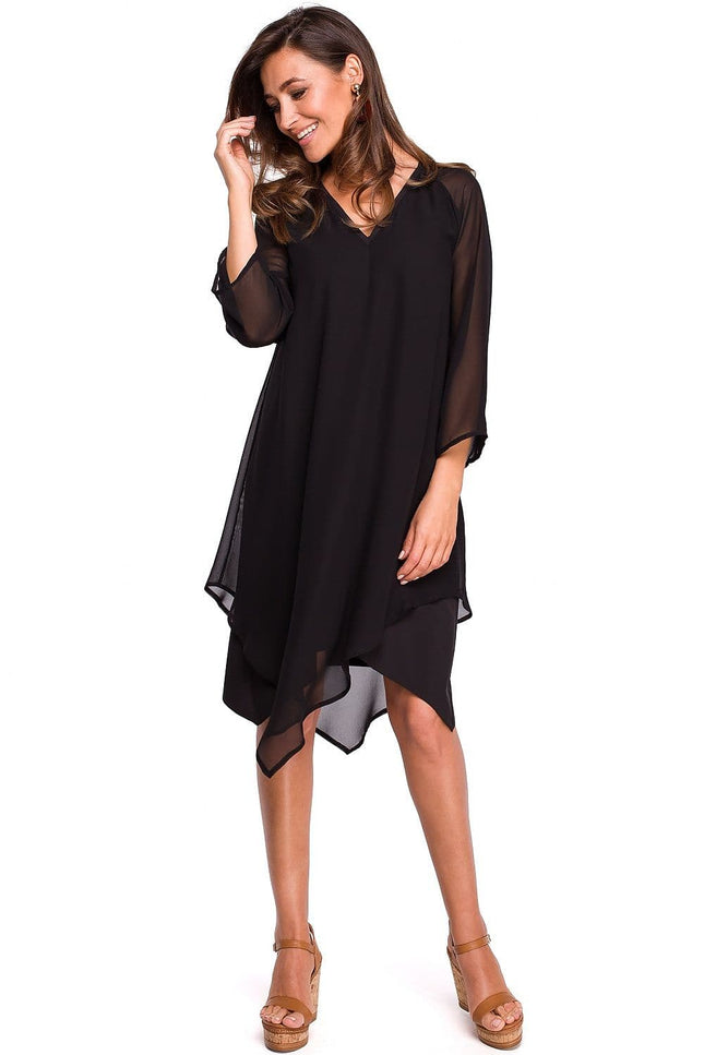 Robe soirée noire midi asymétrique élégante pour cocktail avec manches courtes et encolure dégagée pour une allure chic et moderne.