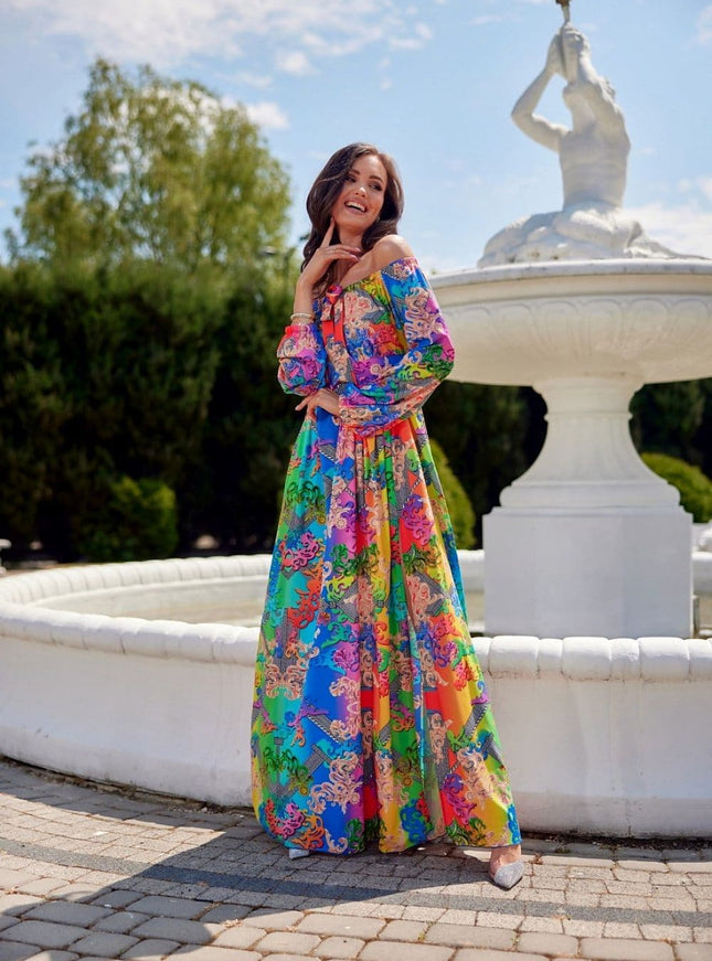 Robe bohème longue fleurie avec épaules dénudées, idéale pour un style boho chic lors de mariages ou soirées estivales.