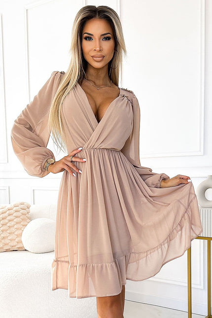 Robe cocktail rose midi avec manches longues et décolleté, idéale pour un look chic et élégant lors d'événements spéciaux.