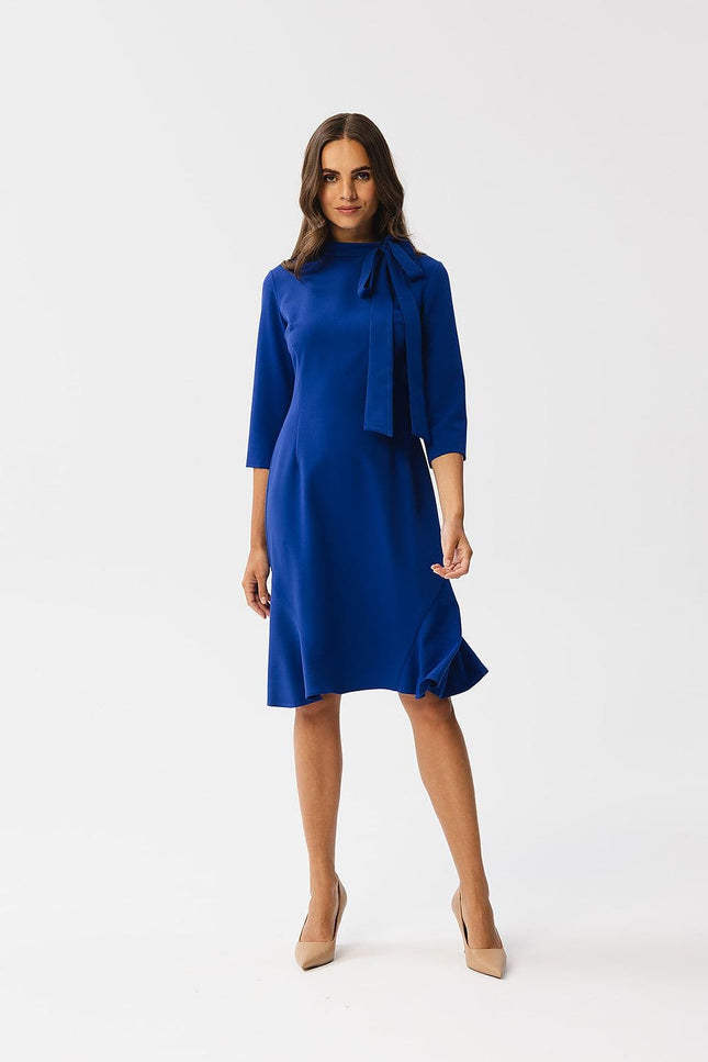 Robe bleue midi chic avec manches courtes et nœud pour cocktail ou soirée, idéale pour une silhouette élégante et moderne.