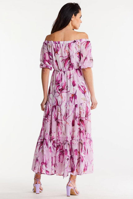 Robe bohème longue rose fleurie à épaules dénudées pour mariage invité chic ou gala, silhouette trapèze avec manches courtes.