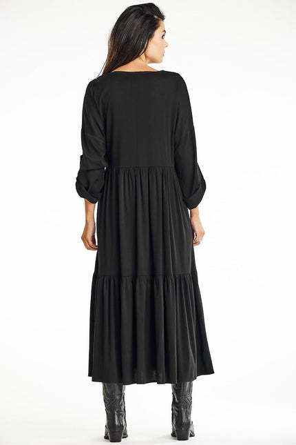 Robe noire longue fluide femme soirée chic manches longues élégante.