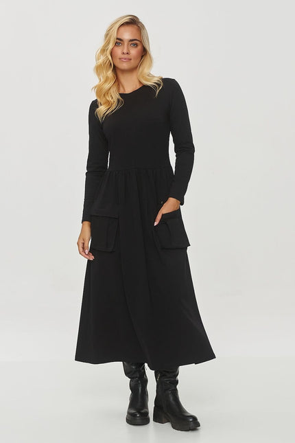 Robe noire manches longues, style casual chic, midi pour soirée simple ou travail, silhouette droite.