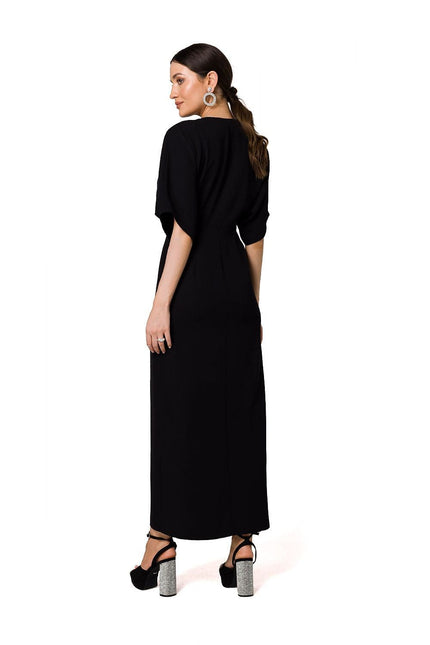 Robe soirée noire élégante longue fendue avec manches courtes, idéale pour gala ou événement chic.