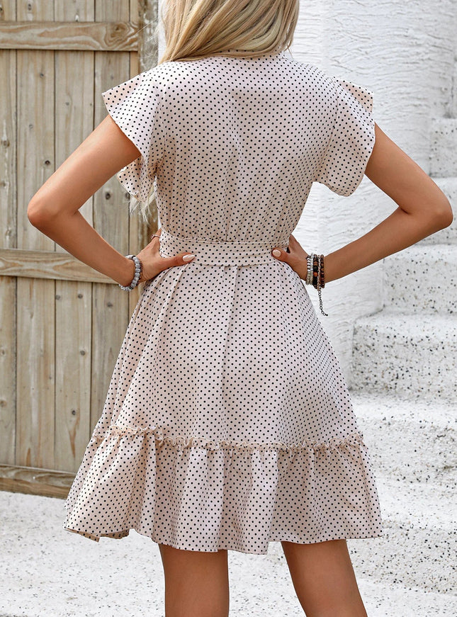 Robe champêtre beige à pois mi-longue avec manches courtes et jupe évasée, idéale pour un mariage champêtre invité.