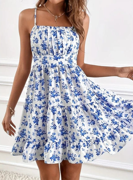 Robe courte bohème bleue et blanche à imprimé floral, sans manches et légère pour l'été ou une soirée décontractée.