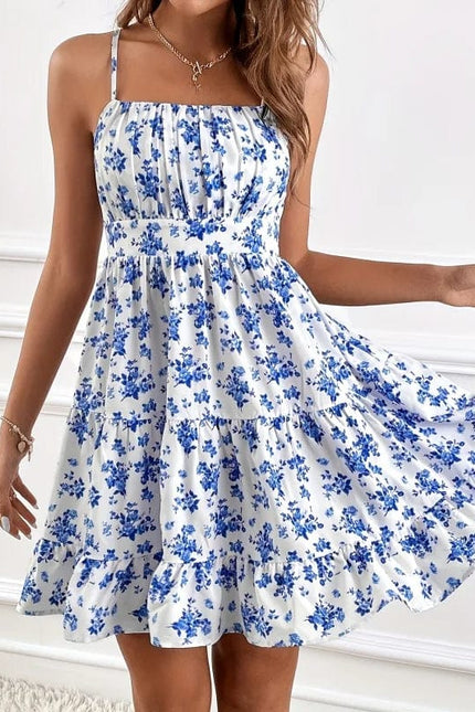 Robe courte bohème bleue et blanche à imprimé floral, sans manches et légère pour l'été ou une soirée décontractée.