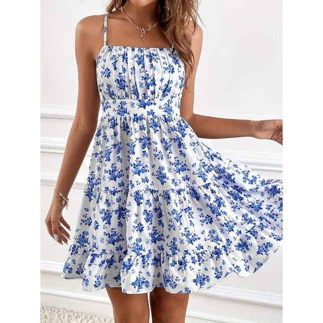 Robe courte bohème bleue et blanche à imprimé floral, sans manches et légère pour l'été ou une soirée décontractée.