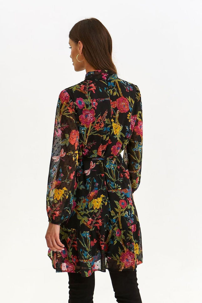 Robe cocktail florale noire courte, style élégant avec manches longues pour soirées ou événements spéciaux.