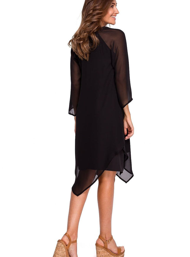 Robe soirée noire asymétrique midi manches longues pour cocktail ou événement chic.