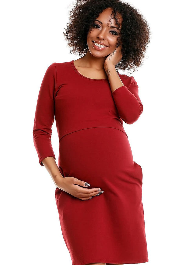 Robe de grossesse chic rouge midi manches longues pour femme enceinte, idéale pour cocktail ou événement.