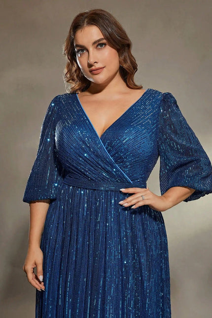 Robe bleue pailletée style soirée chic à manches longues et décolleté, longueur midi pour femme grande taille.