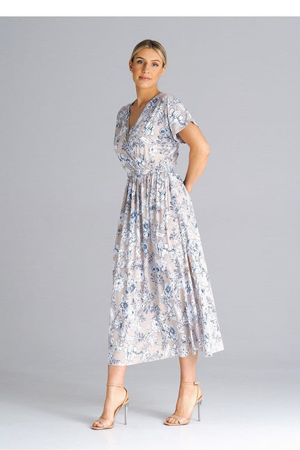 Robe midi fleurie chic blanche pour cocktail ou mariage invité, avec manches courtes et silhouette trapèze.