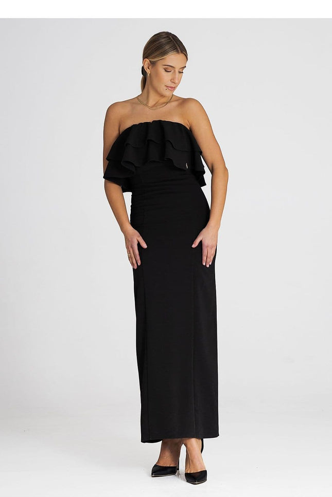 Robe soirée noire longue chic avec épaules dénudées, idéale pour cocktail ou gala, silhouette moulante et féminine.