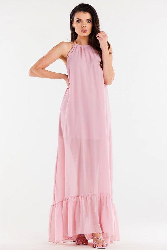 Robe rose longue fluide sans manches pour soirée élégante, avec détail de ruché au bas, parfaite pour cocktail ou gala.