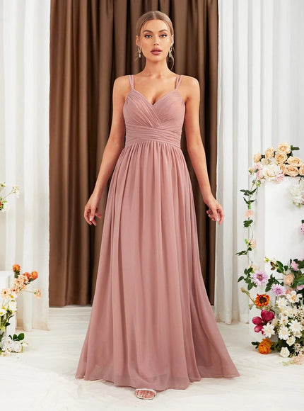 Robe demoiselle d'honneur longue rose poudré avec dos nu, idéale pour mariage chic et élégante.