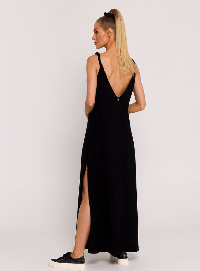 Robe soirée noire longue simple, décolleté en V, avec fente latérale, idéale pour événements élégants, silhouette droite, sans manches.