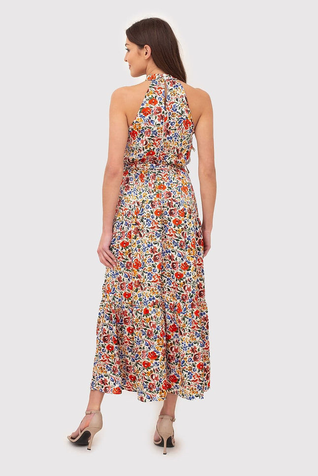 Robe d'été fleurie longue sans manches, style bohème et légère, idéale pour la plage ou une journée ensoleillée.