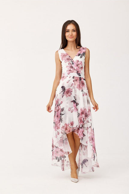 Robe fleurie asymétrique midi pour mariage invité chic, sans manches avec un motif floral rose sur fond blanc.