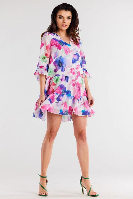 Robe florale courte à manches longues, idéale pour cocktail ou gala, style bohème chic et couleur vive.