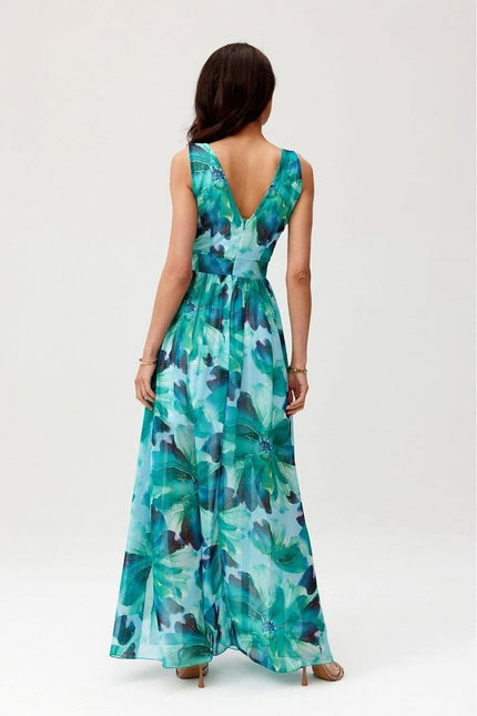 Robe soirée fleurie longue verte, parfaite pour gala ou mariage, en style bohème chic avec silhouette trapèze.