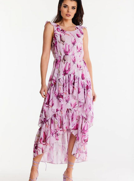 Robe d'été fleurie rose midi sans manches idéale pour une balade sur la plage ou un évènement décontracté.