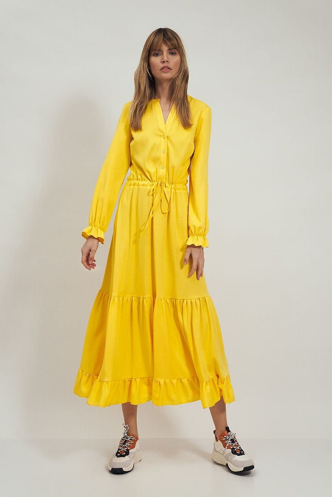 Robe jaune fluide midi à manches longues idéale pour un cocktail, une soirée chic ou un événement de printemps.