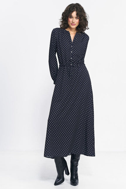 Robe noire à pois longue avec manches longues, idéale pour soirée, style vintage chic et élégant, parfaite pour cocktail ou gala.