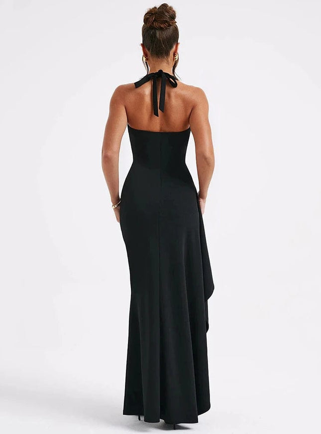 "Robe longue noire fendue élégante pour soirée chic ou gala, avec dos nu et lien à nouer, silhouette moulante et évasée."