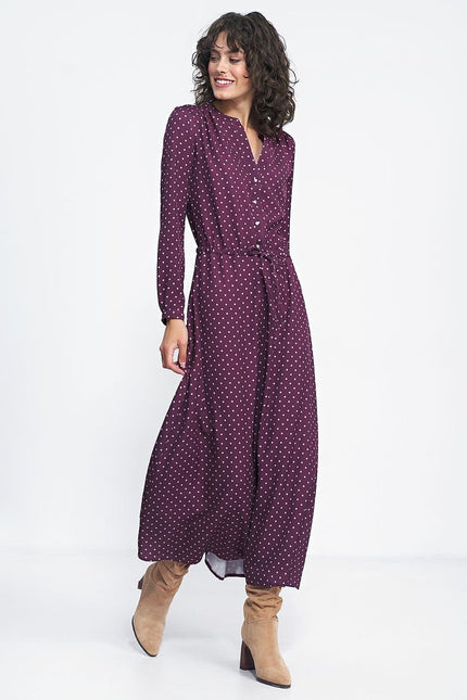 Robe longue soirée manches longues couleur bordeaux à pois pour cocktail ou événement chic.