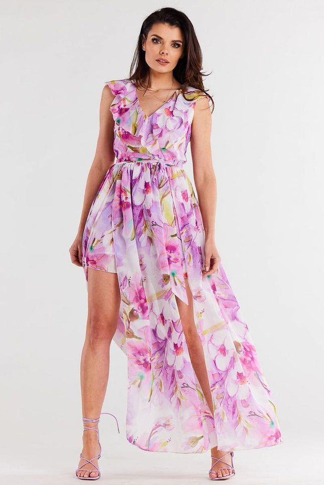 Robe longue fleurie rose sans manches, idéale pour un mariage ou une soirée d'été, avec une silhouette fluide et élégante.