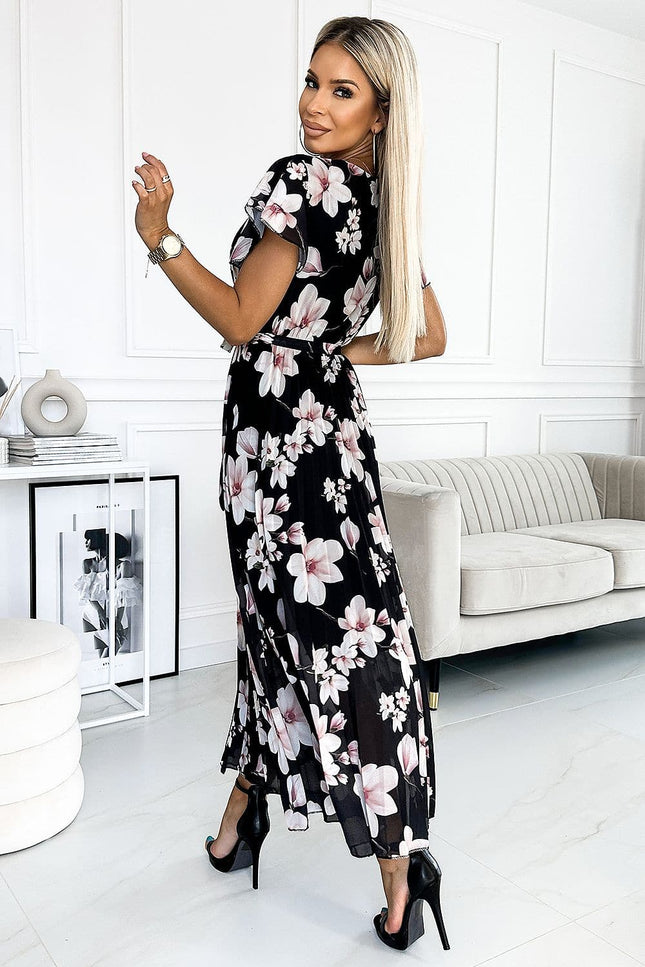 Robe d'été fleurie noire midi moulante avec manches courtes pour un style chic et féminin.