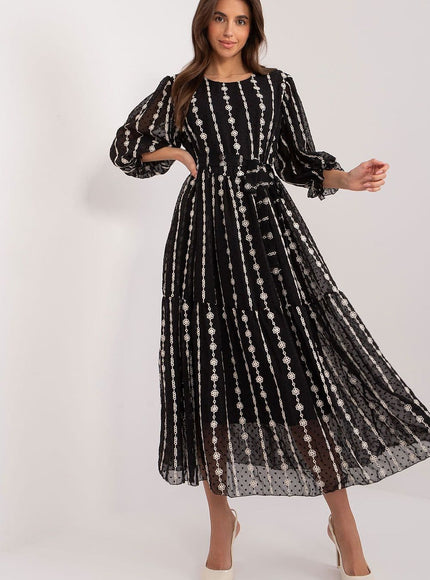 Robe soirée paillette noire midi à manches longues et silhouette trapèze, idéale pour un cocktail ou un événement élégant.