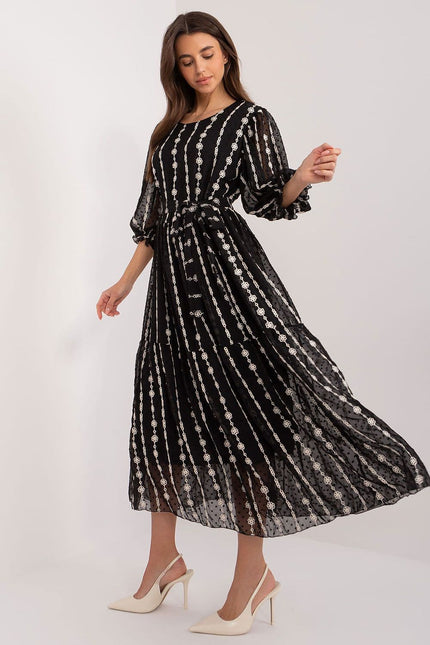 Robe de soirée pailletée noire midi à manches longues, élégante pour cocktail ou événement, silhouette trapèze.