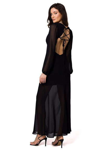 Robe soirée noire longue élégante avec dos nu et manches longues, idéale pour gala ou événement chic.