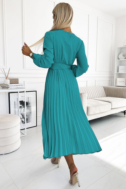 Robe soirée chic verte midi moulante avec manches longues, parfaite pour cocktail ou évènement gala.