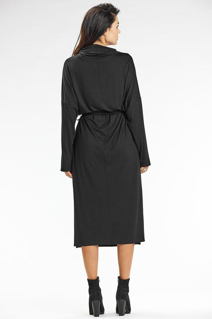 Robe noire midi chic pour soirée, manches longues, ceinturée, idéale cocktail ou gala.